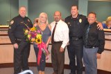 Tammi Madrigal (center) joins, left to right, Jim Cheney, Mayor Ray Madrigal, Chief Darrell Smith, and City Manager Nathan Olson.